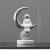 figurine astronaute croissant lune argent